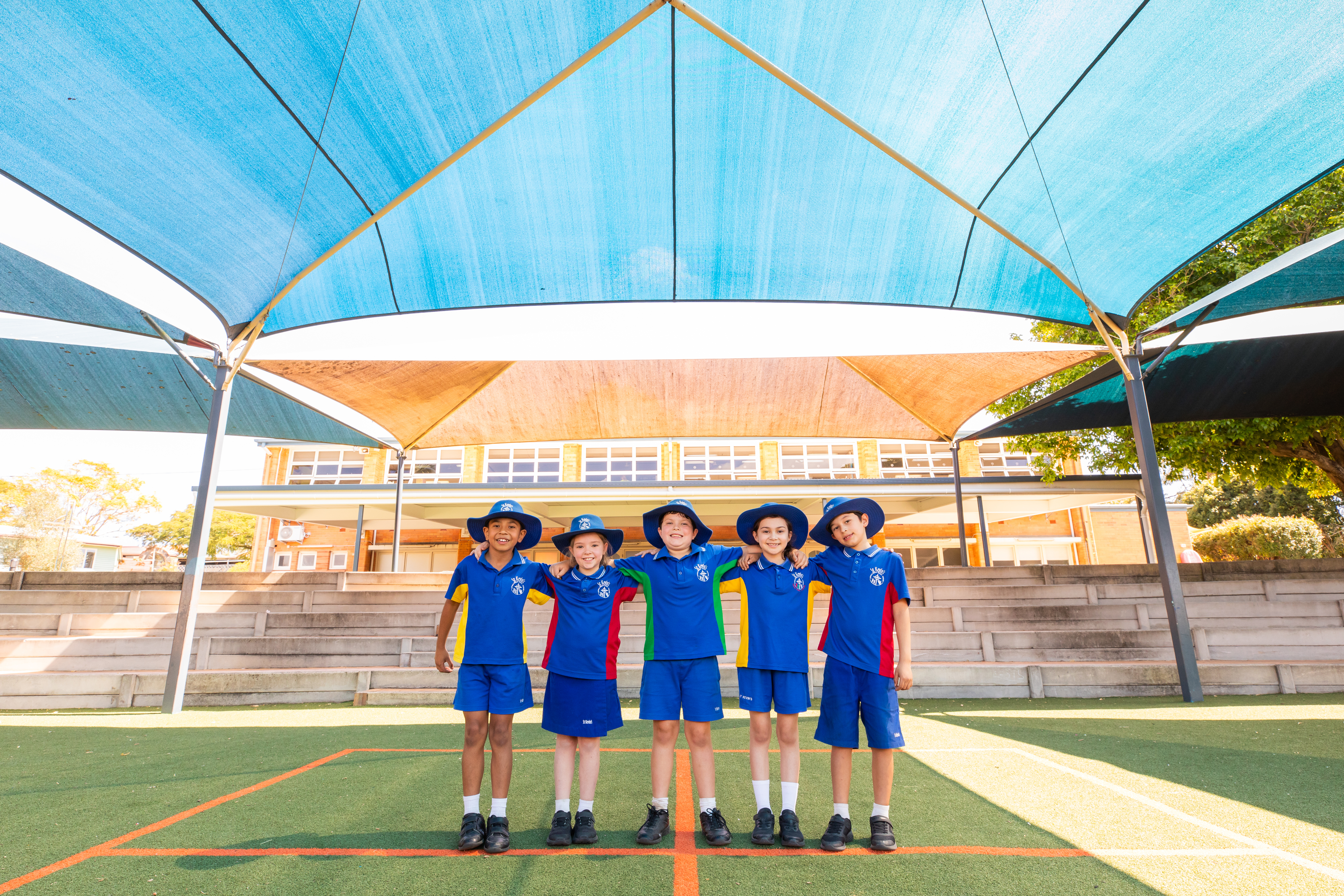 Students hand in hand at St Kevin's School